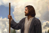 white cloud frames profile of Jesus in blue robe holding a staff