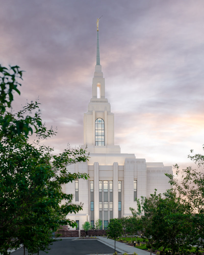 The Red Cliffs Utah Temple at sunset with purple skies.