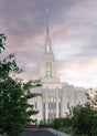 The Red Cliffs Utah Temple at sunset with purple skies.