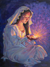 A woman kneeling with a lamp in her hands.