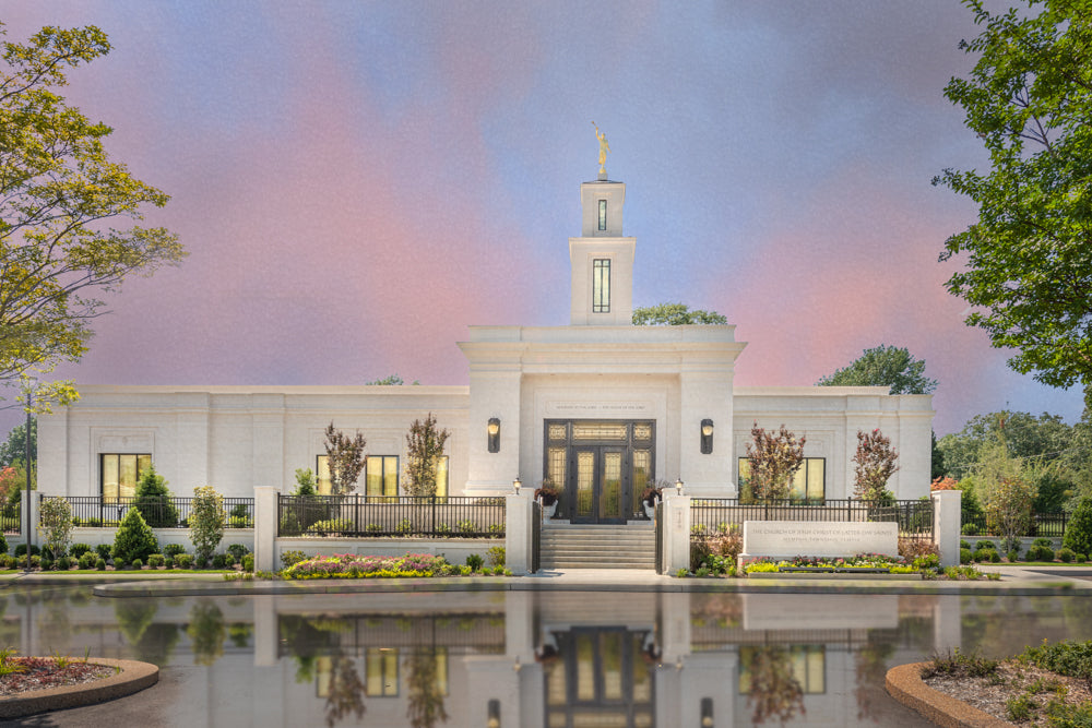 The Memphis Tennessee temple with a pink and blue sky.