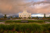 The Saratoga Springs Utah temple with greenery and mountains.