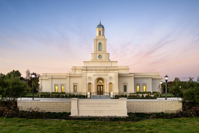 The Bentonville Arkansas temple with a pink and blue sky.