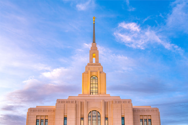 The Red Cliffs Utah temple with a blue and pink sky.