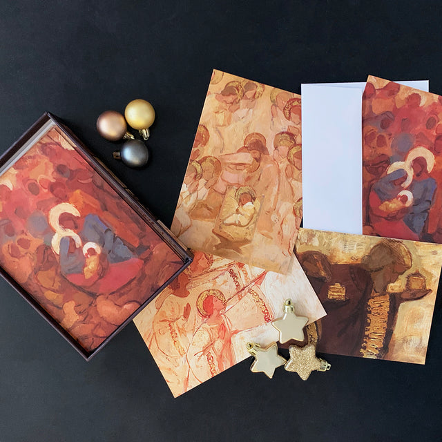 A collection of J. Kirk Richards boxed Christmas cards featuring a nativity scene and festive decorations.