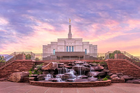 Photo of the Snowflake Temple. Water flows down a set of rocks in front of the entrance.