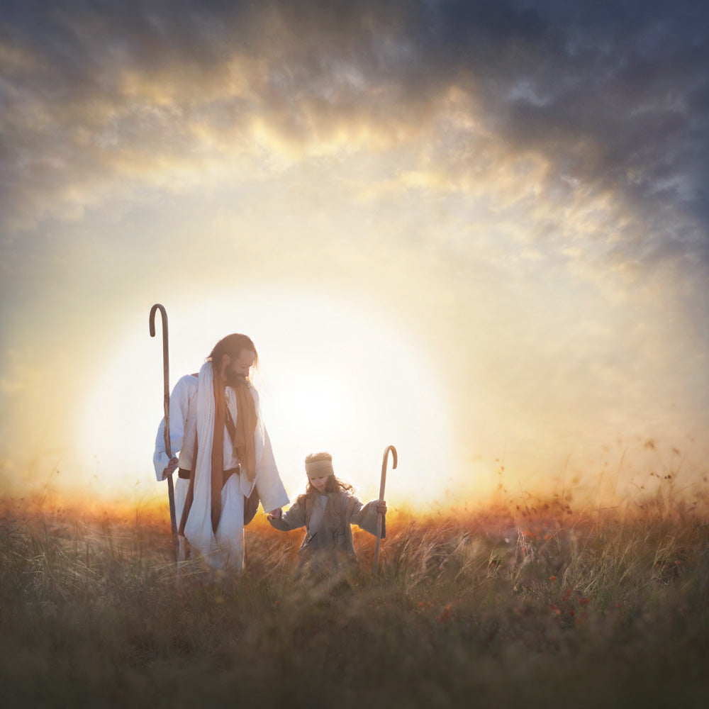 Jesus and a young shepherd holding hands walking in field. 