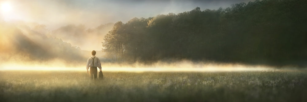 Young Joseph Smith walking towards a grove of trees. art 1