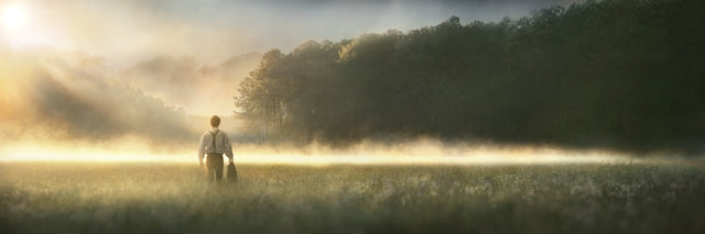 Young Joseph Smith walking towards a grove of trees. art 1