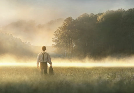 Young Joseph Smith walking towards a grove of trees. art 2