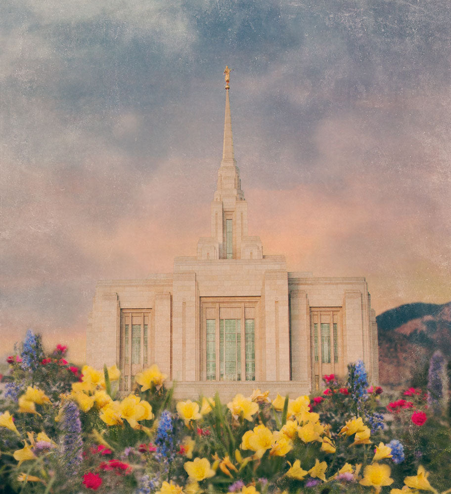 Ogden Utah Temple with blue and yellow flowers. 